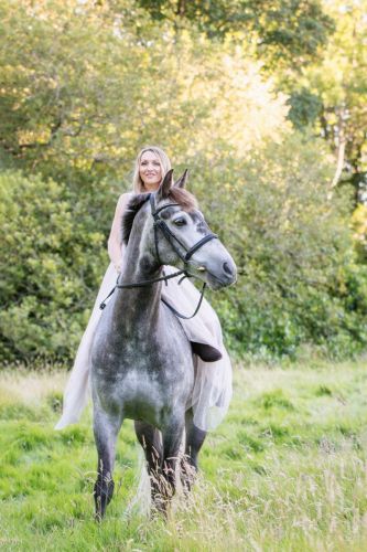 A girl on her horse riding bareback